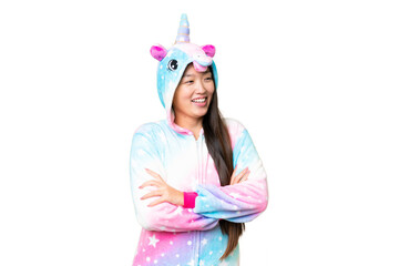 Young Asian woman with unicorn pajamas over isolated chroma key background happy and smiling