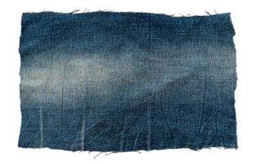 Piece of torn denim on a white background. Denim texture