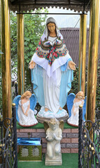 Blessed Virgin Mary Sculpture dressed in a scarf.