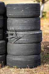 A pile of old tires stacked on top of each other