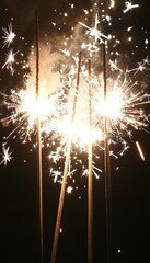 Sparkler fireworks light up the night sky, creating a festive and celebratory atmosphere.