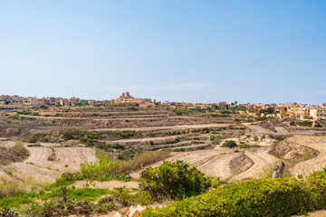Obraz premium village of Gharb on Gozo and Basilica of the National Shrine of the Blessed Virgin of Ta' Pinu. Malta