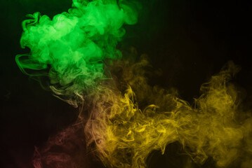 Yellow and pink steam on a black background.