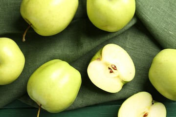 Ripe apples on green wooden table, top view