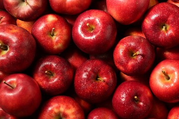 Fresh ripe red apples as background, top view