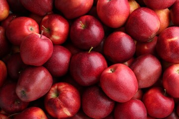 Fresh ripe red apples as background, top view