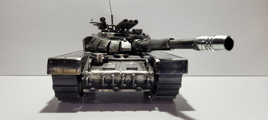 T-90A Russian tank inspiration. Scrap metal art welding sculpture. Armored vehicle scale model make with recycled metal.