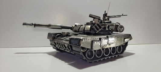 Obraz premium T-90A Russian tank inspiration. Scrap metal art welding sculpture. Armored vehicle scale model make with recycled metal.