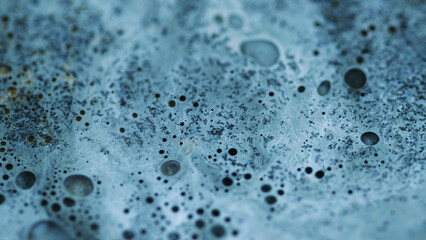 Paint foam texture. Sparkling acryl spill. Blur blue color glitter magic wave liquid bubble emulsion wave flow abstract art background.