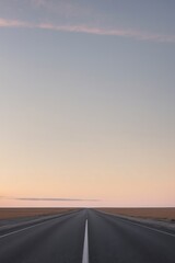 Serene Empty Road Under Vast Sky at Dusk.