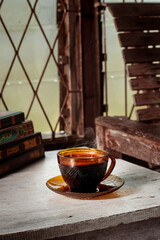 cup of coffee on wooden table