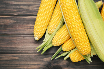 Sweet corn on wooden background