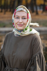 Russian beauty - young beautiful woman in a traditional headscarf