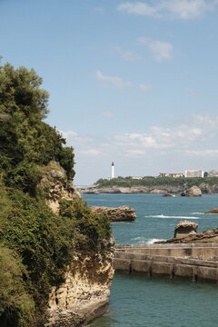 Phare de Biarritz. Tall lighthouse built in 1834, on a rocky cliff with sweeping ocean & town views. 