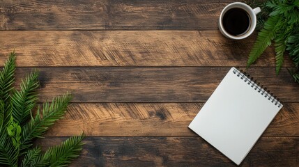 Coffee cup and notebook on wooden table