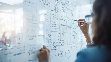 Close-up of mathematical diagrams and calculations on a whiteboard with an engineering student presenting findings