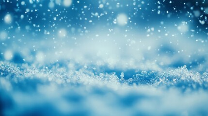 Fototapeta premium Close-up of Snow Falling on a Blue Surface