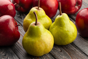 pears apples on wood background
