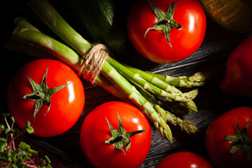 asparagus on black wood background top view
