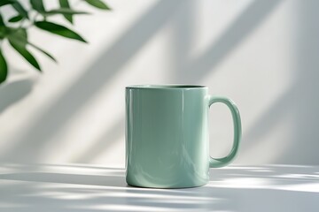 Obraz premium Green ceramic mug on table with shadows