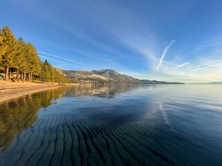 Serene Lake and Mountain Landscapes at Sunrise and Sunset