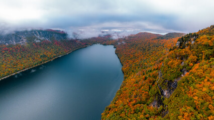 Epic Incredible Aerial View Early Morning Fog Over Lake Willoughby New England Vermont. Autumn Season Fall Foliage Forest of Trees Colorful.