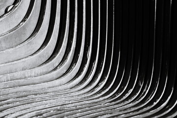 A classic curved bench in black and white.