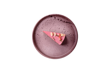 Piece of sweet cheesecake with pink cream cheese of raspberry or strawberry flavor