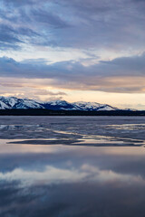 Peaceful Evening at Yellowstone Lake with Snowcapped Mountains