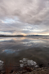 Serene Yellowstone Lake Reflecting Dramatic Cloudy Skies