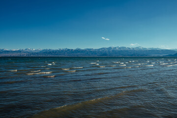 Issky-kul lake in Kyrgyzstan, summer picturesque landscape