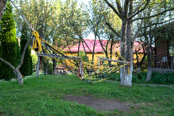 Hammock tied to trees in garden