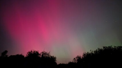 Aurora borealis, northern lights in the sky above Dangan, Galway, Ireland, nature background