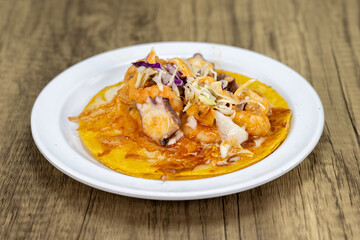 Grilled octopus, shrimp, and oyster taco served with cabbage and cheese for a delicious lunch