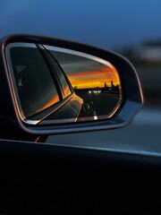 view sunset in the car mirror