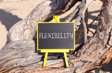 Flexibility symbol. Concept word Flexibility on beautiful chalk blackboard. Beautiful old wood and...