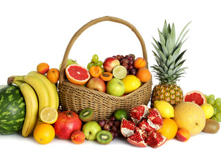 Many different fresh fruits in wicker basket isolated on white