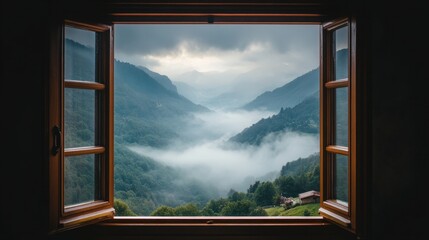 A foggy mountain view from an open window, with fresh morning air and mist hanging in the valley.