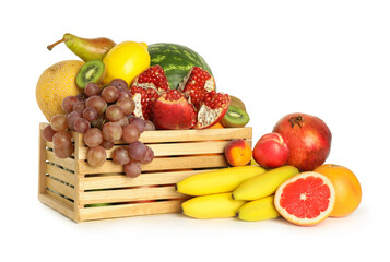 Wooden crate with many different fresh fruits isolated on white