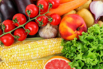 Different fresh vegetables and fruits as background, top view