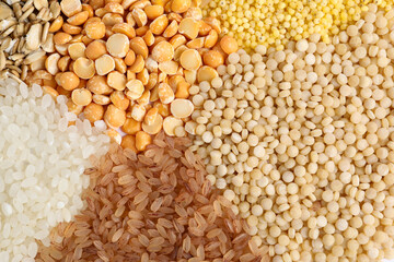 Different cereal grains as background, top view