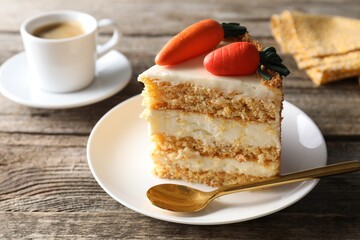Piece of delicious carrot cake on wooden table, closeup
