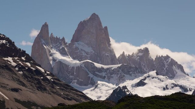 Mist rolling around Mount Fitz Roy on a sunny day, timelapse