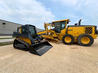 Road construction equipment. Side view.