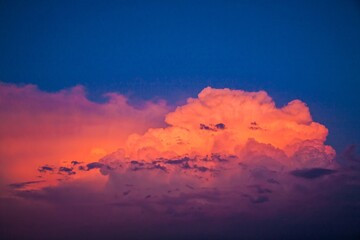  Thunderhead clouds reflecting the sunset over an agriculture field in northeast North Dakota,