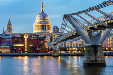 Fototapeta premium St. Paul's cathedral and Millennium bridge over Thames river at sunset, London, UK