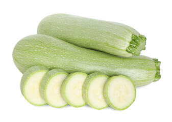 Fresh whole and cut zucchinis isolated on white, above view
