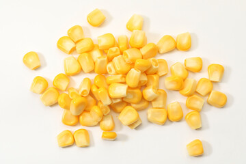 Pile of fresh corn kernels on white background, flat lay