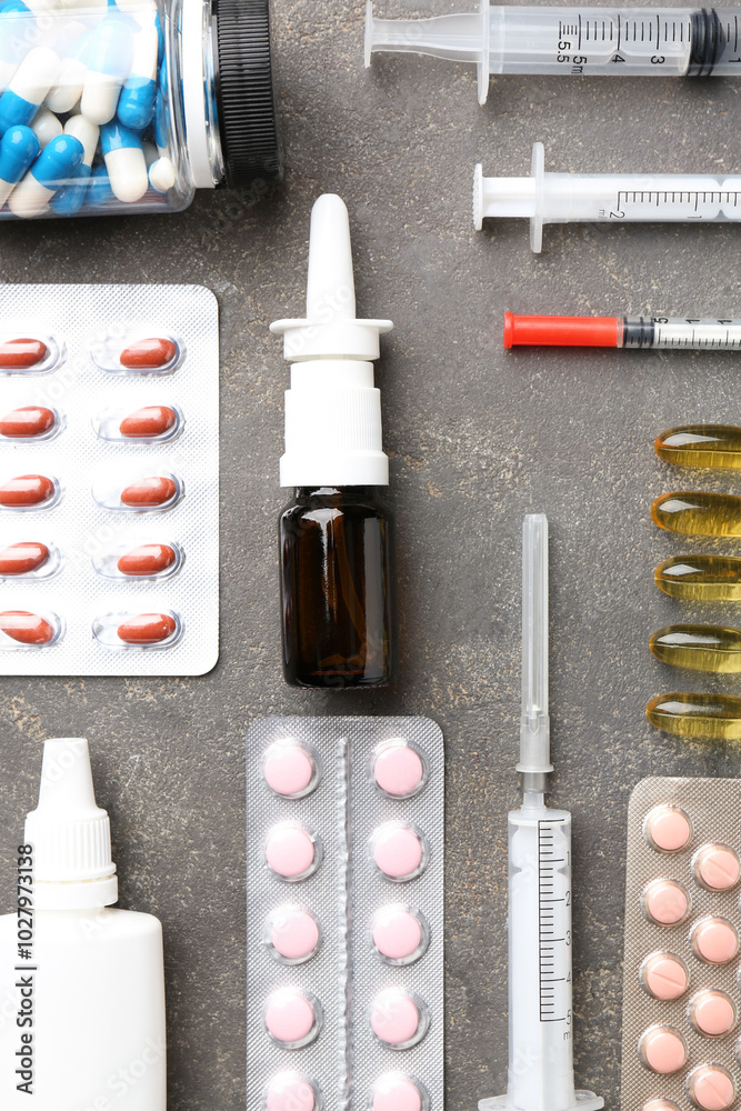 Canvas Prints Pharmacist. Different pills, syringes and bottles of medical drops on grey table, flat lay