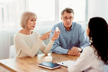 Consult Your Doctor. Senior woman asking her nurse about indications and contraindications of new medicine, copyspace